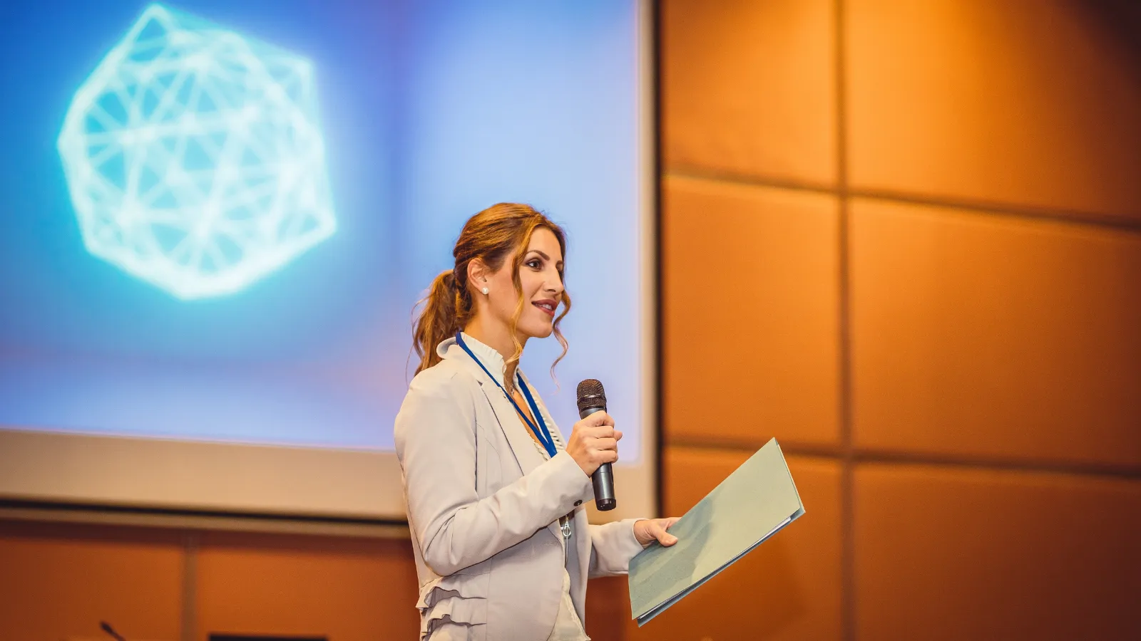 Storytelling Skills Can Accelerate Your Career Professional speaker presenting ideas to an audience, demonstrating confident communication and career storytelling