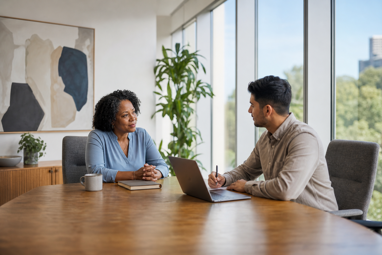 Manager coaching conversation in private office